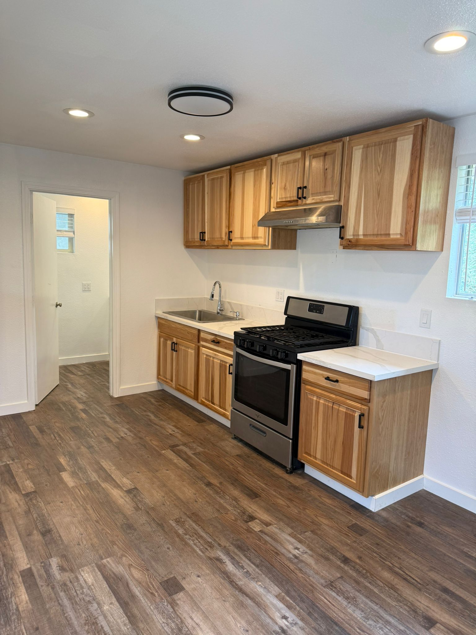 After: Refinished Cabinets with New Hardware